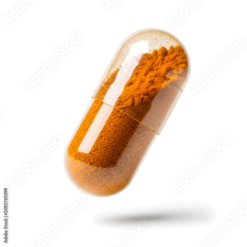 Turmeric herbal supplement capsule isolated on white background