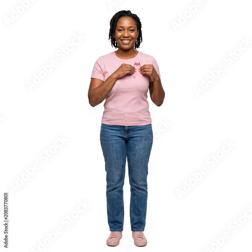 Woman smiles holding pink breast cancer awareness Outubro Rosa ribbon on her t shirt PNG Isolated on transparent background