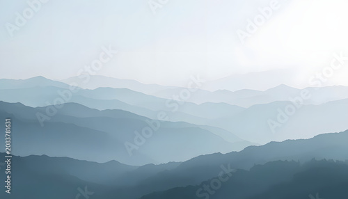 Soft Blue Mountain Layers Landscape with Misty Atmospheric Gradient Background