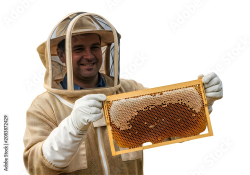 Beekeeper holding a honeycomb frame with protective suit and gloves isolated on white background