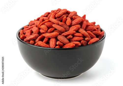 Bowl of dried goji berries on a reflective surface isolated on white background