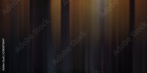 Valokuva Abstract dark background with soft vertical golden light rays emerging from shadows for elegant professional photography use