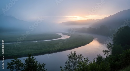Misty River Winding Through a Verdant Valley at Sunrise