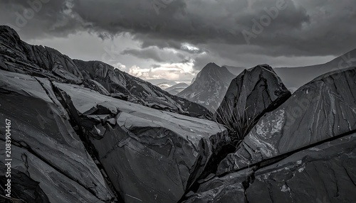 Dramatic stormy sky over a rugged mountain range, desaturated landscape, ominous atmosphere, natural geology, epic vista