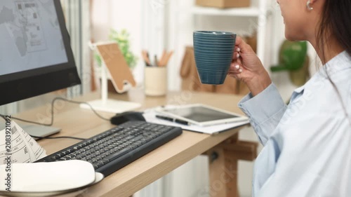 Ecommerce, order, management, online, seller types at computer beside ceramic plates and shipping labels, handling product records and customer orders in home office for smooth daily business workflow