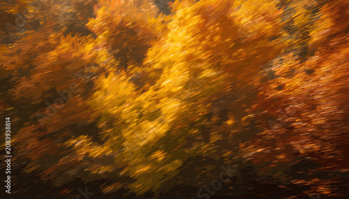 Foto Vibrant autumn foliage blurred by motion, showcasing a dynamic abstract of yellow and orange leaves in a forest