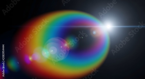 Vibrant rainbow lens flare with anamorphic light streak isolated on a dark black background