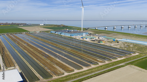 Kats, Zeeland, Netherlands - 08 April 2026: Aerial view of Fish Farm Basins near Zeelandbrug in Zeeland