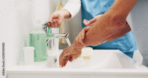 Fotografía Support, nurse and old person at sink with handwashing, bacteria prevention or wellness in elderly care