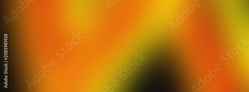 Abstract gradient texture featuring vibrant blend of warm orange and golden yellow colors with a subtle soft grainy noise effect
