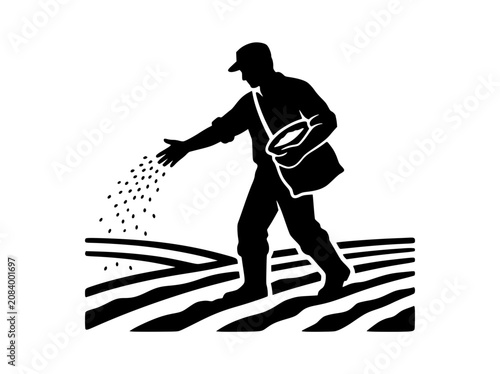 Silhouette of a Farmer Sowing Seeds in a Ploughed Field