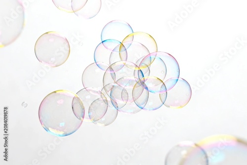 Colorful Bubbles Floating Against White