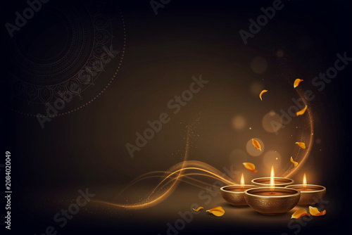 Three ornamental traditional Indian oil lamps with glowing wicks illuminate a serene scene adorned with vibrant golden light swirls and scattered delicate orange petals for a spiritual celebration
