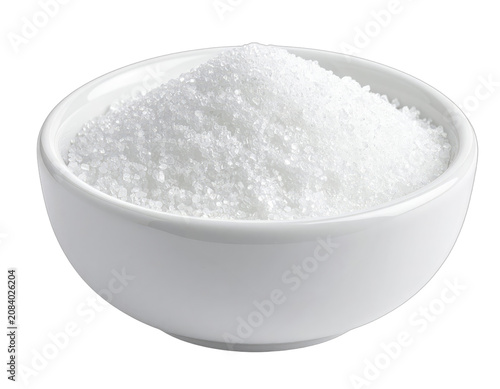 A white bowl filled with granulated sugar on a black background.