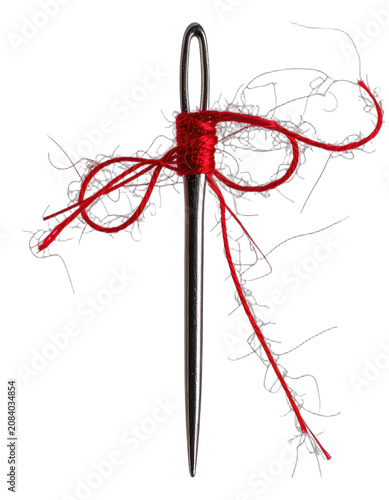 A sewing needle with red thread tied around its eye on a black background.