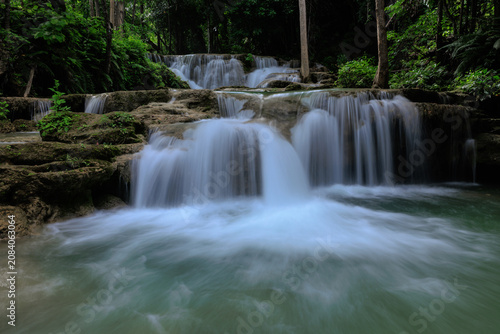 Cascading Tiered Waterfalls Flowing Through The Lush Tropical Rainforest Of Huai Mea Khamin Waterfall Kanchanaburi Thailand