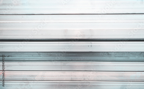 Abstract shiny silver aluminum surface textures background. Blank space.