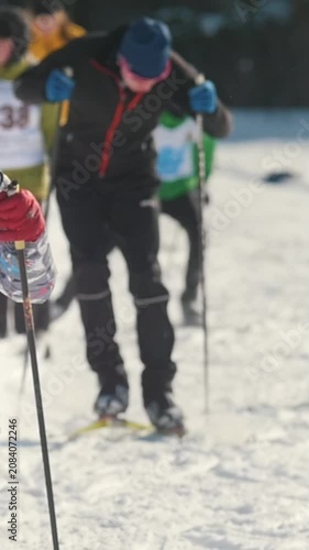 Cross country skier races on snowy trail with intense focus and determination