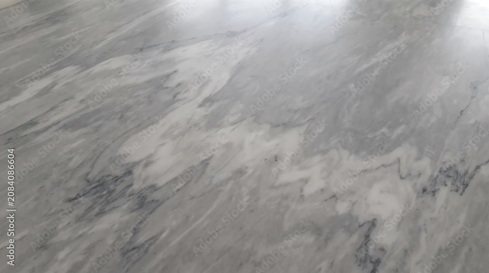 Fototapeta premium Smooth grey polished marble surface with natural veining texture