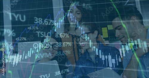 Chart overlay appearing, team gathering around laptop and tablet, pointing and analyzing stocks