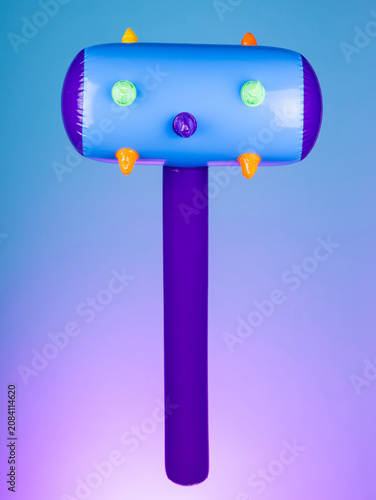Close-up of an inflatable mace with spikes on a purple background, emphasizing its rugged and bold design—perfect for playful battles or quirky decor