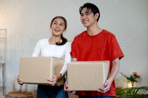 Couple Unpacks Boxes Together While Settling Into New Home