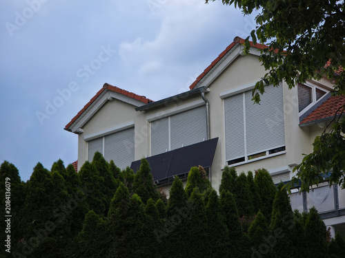 Fotografía germany, two photovoltaic modules installed in front of residential house window