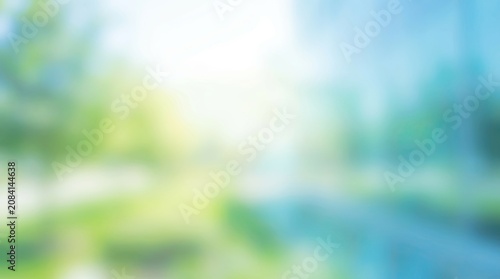 Soft focus green and blue nature background with summer sunlight and bokeh.