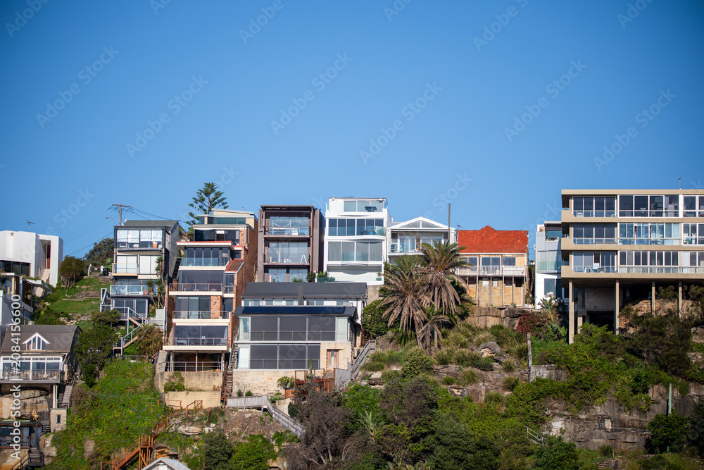 Fototapeta premium Modern Coastal Homes Along Hillside Landscape