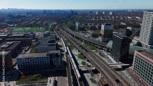 Aerial view of city train tracks and modern buildings