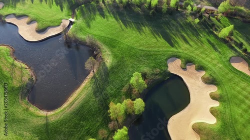 Golf course landscape with green grass and sand traps