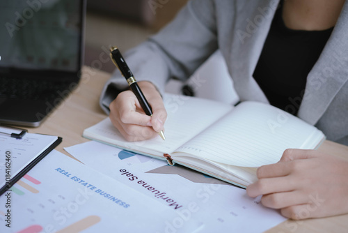 Business Professionals Reviewing Financial Reports and Performance Charts