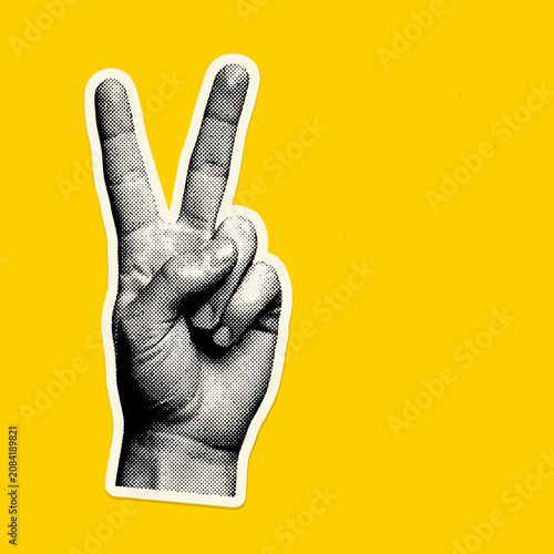 Obraz na plátně A retro halftone peace sign hand sticker on a yellow background
