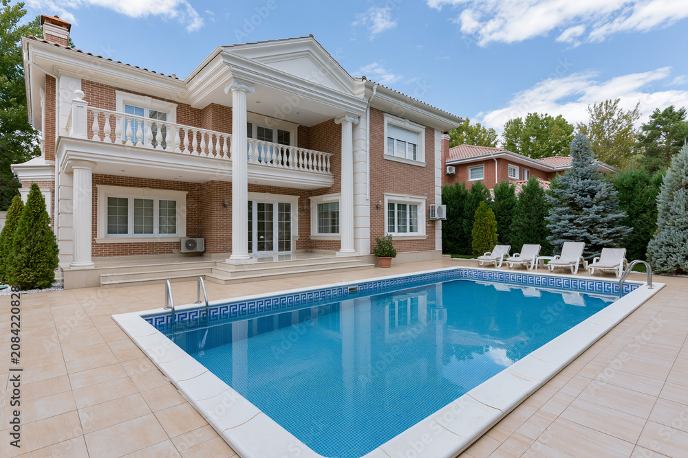 Fototapeta premium Modern home with pool in residential area