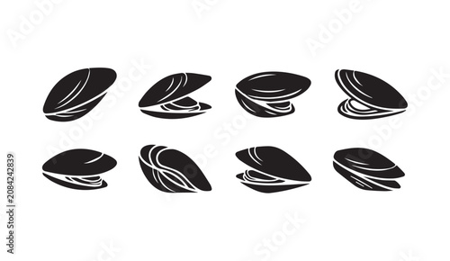 Collection of opened and closed mussel shells isolated on white background with subtle highlights