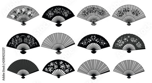 Collection of vintage folding hand fans decorated with elegant traditional floral patterns and plain monochrome designs.