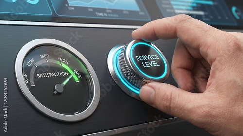 Business hand turning service level control dial for maximum customer satisfaction on digital dashboard interface.