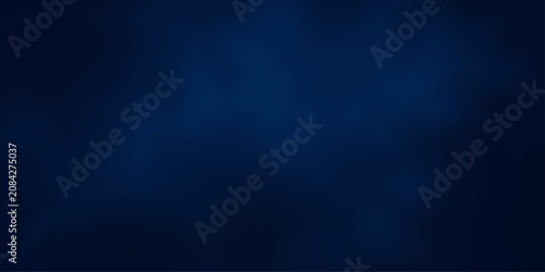 Bild auf Leinwand A deep, textured navy blue background, subtly illuminated by soft, diffused light sources creating a gradient of shadow and subtle highlight, evoking a sense of depth and sophistication