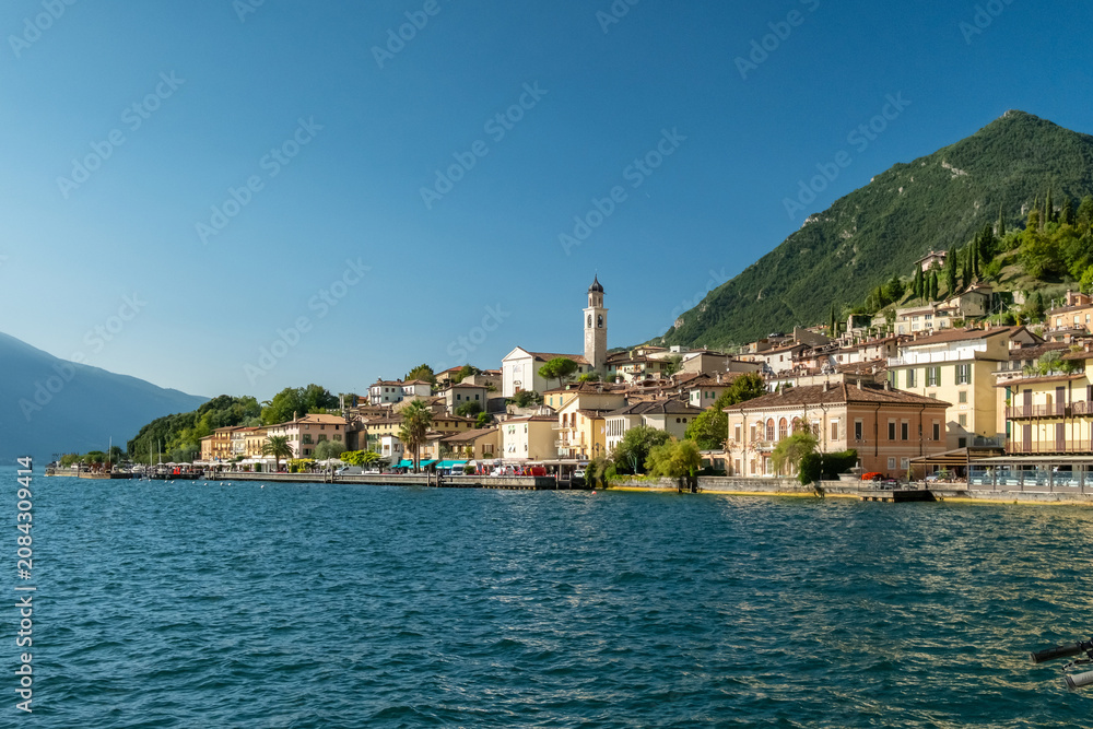 Fototapeta premium Old town harbor and lakefront view, Limone sul Garda, Italy