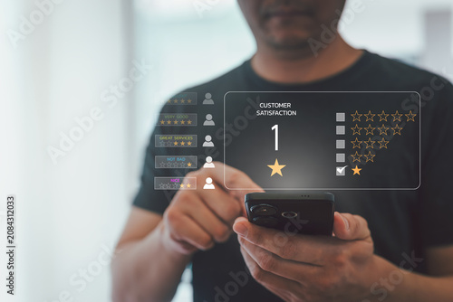 Person touch smartphone to submit 1 star customer satisfaction rating with virtual review interface, negative feedback, poor service, customer complaint, bad experience and reputation management.