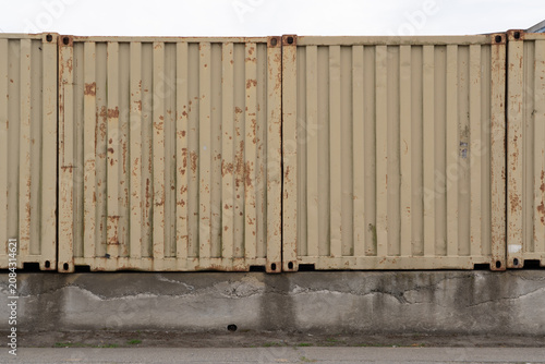 Canvastavla makeshift fence constructed from intermodal cargo containers