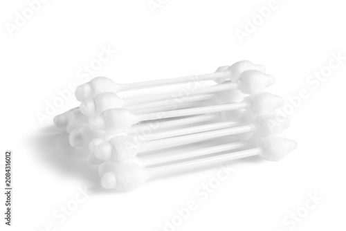 Stack of cotton buds on whi...