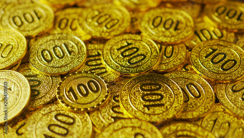 Bilde på lerret Numerous gold coins are stacked together, representing a high-value gold investment concept, gleaming and luxurious