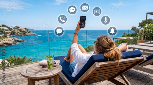 Woman Using Mobile Phone at the Beach During Vacation
