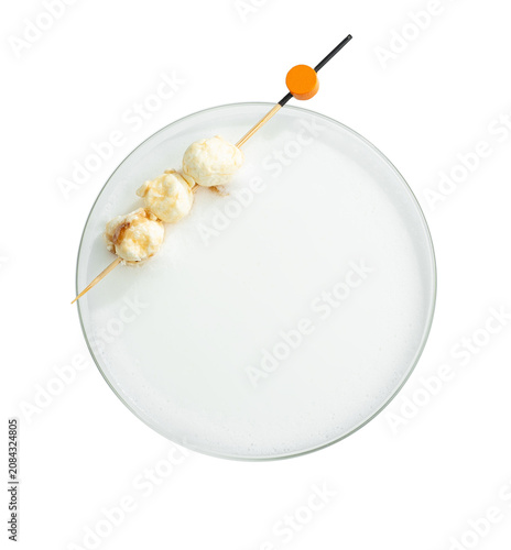 Creamy Cocktail with Foam and Cheese Ball Skewer Garnish Isolated on Black Background, Top View