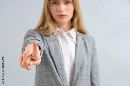 Young businesswoman using v...