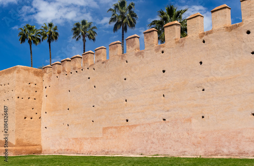 Historic Medieval Earthen City Walls and Palm Trees in Marrakech, Morocco