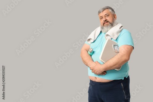 Overweight mature man with ...