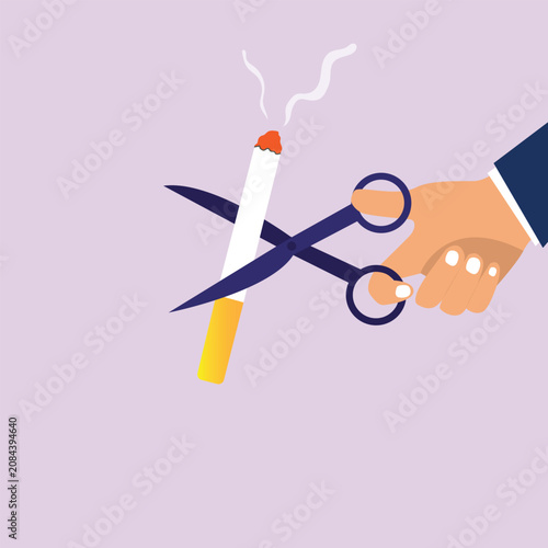 Foto Hand cutting cigarette using scissors