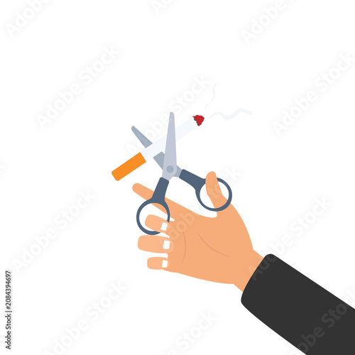 Foto Hand cutting cigarette using scissors